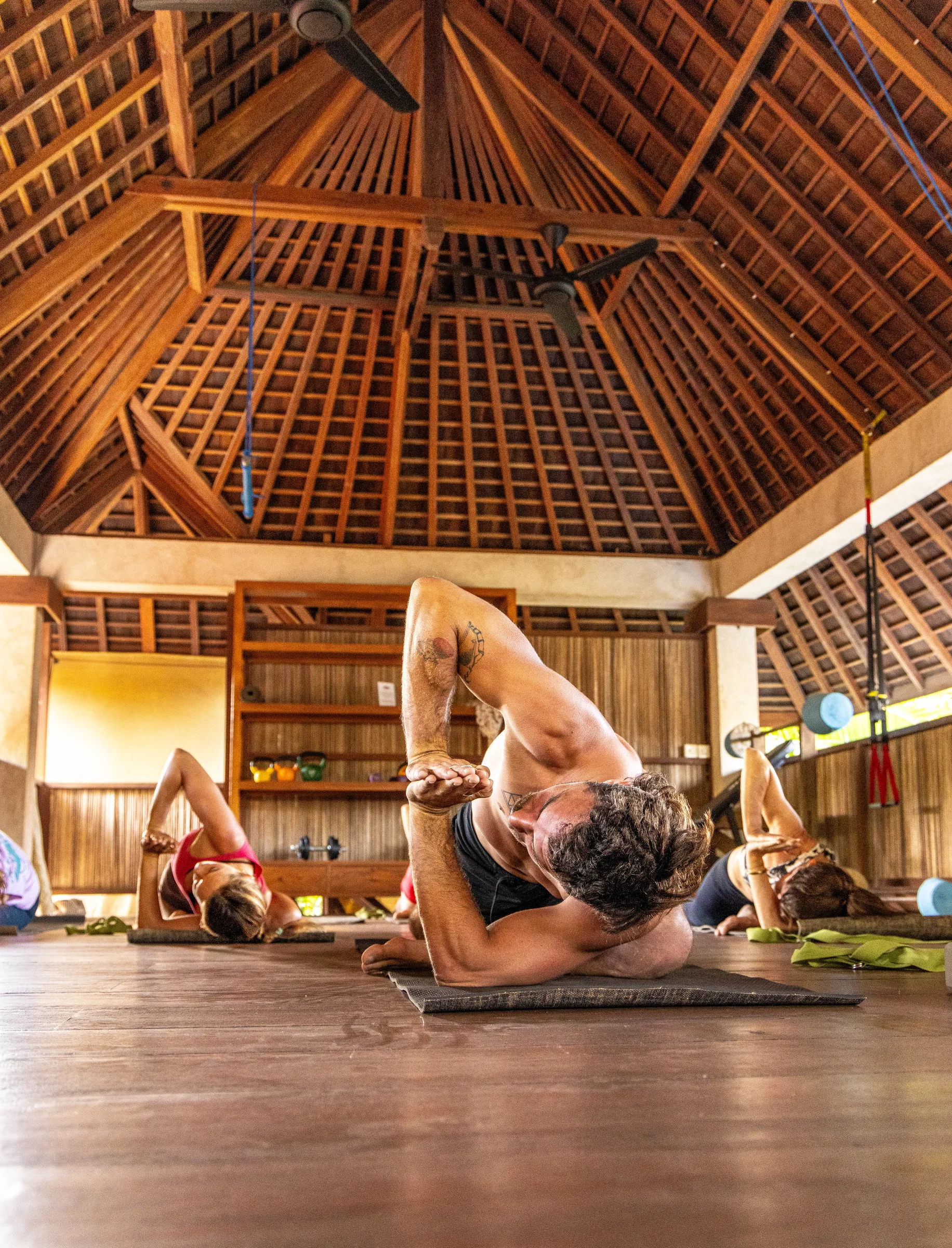 Yoga practice in the timber yoga shala at Keong Villas
